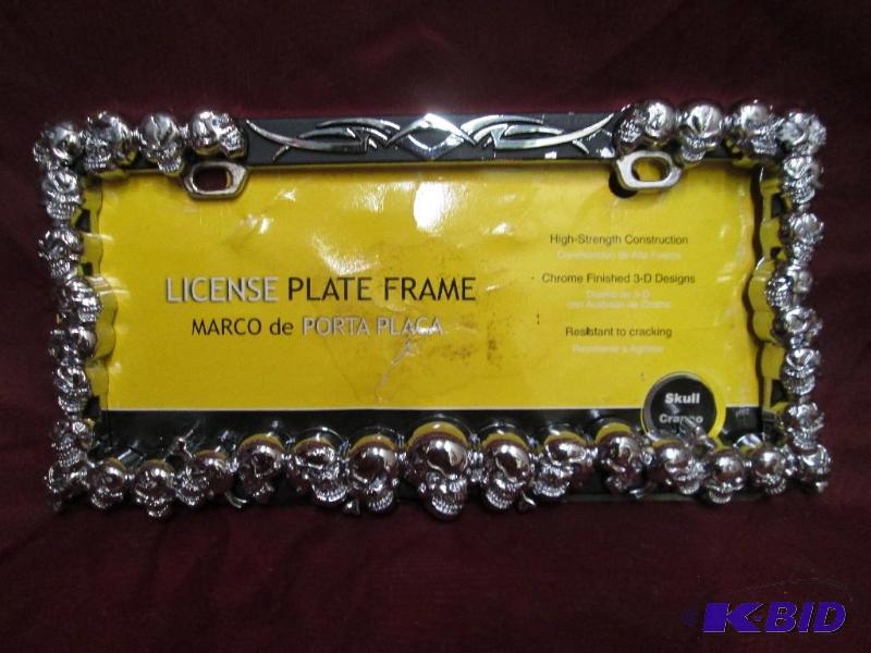 lot 41 image: License plate frame featuring skull...