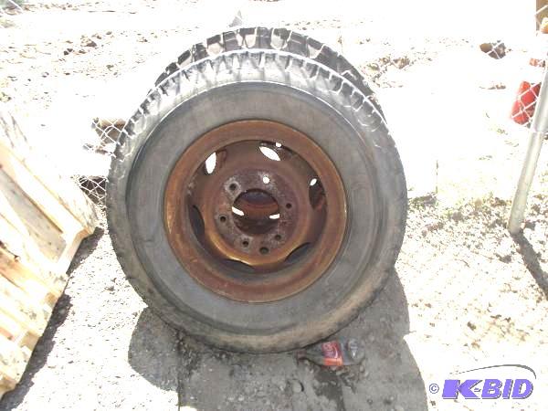 lot 93 image: (2) Rims and Tires   10.00-20 Tire ...