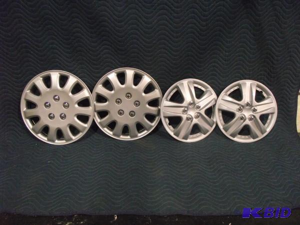lot 14 image: Hub Caps   All 4 Not matching  Sets...