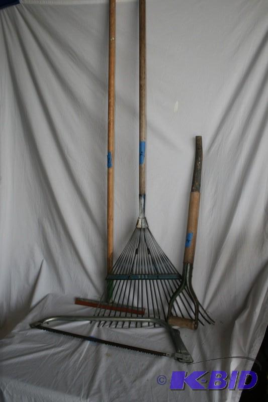 lot 104 image: Rake, window squeegee, hand saw, fo...