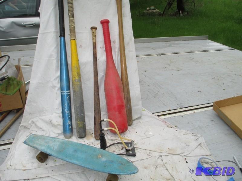 lot 111 image: Baseball bats, skateboard, sling sh...