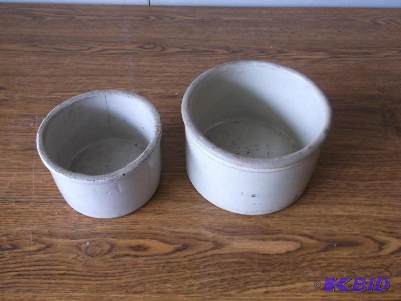 Vintage butter crocks one has 2 hai...