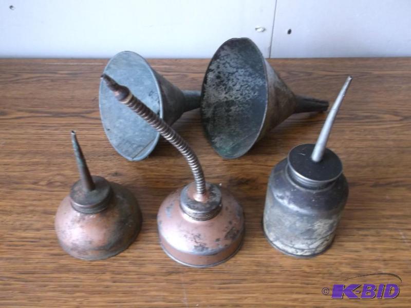Vintage oil cans &amp funnels....
