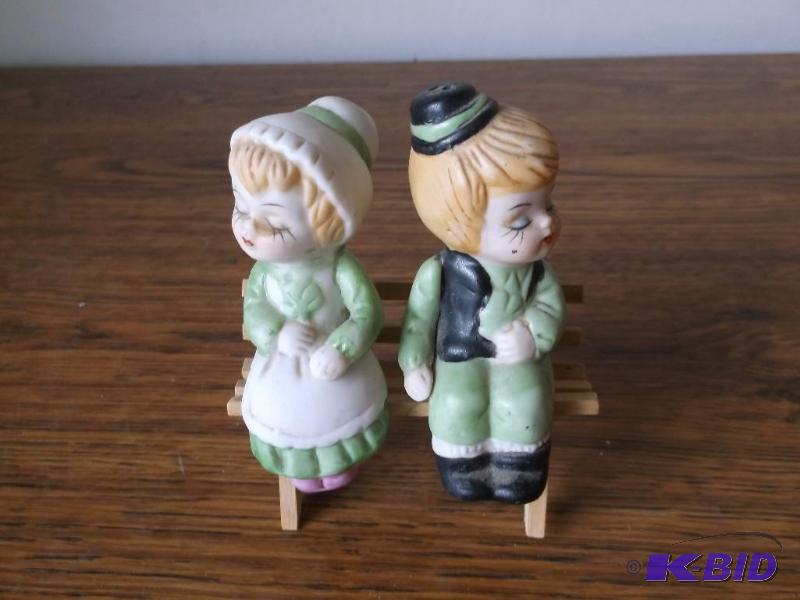 Cute boy an girl sitting on bench s...