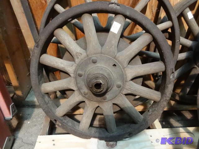 Old car wheel with wood spokes...