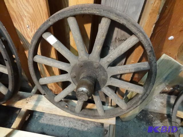 Old car wheel with wood spokes...