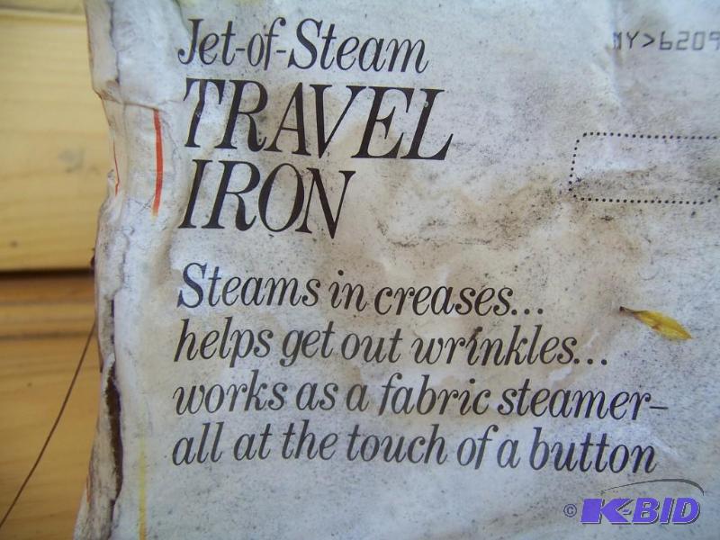 Travel iron. Still in package. Pack...