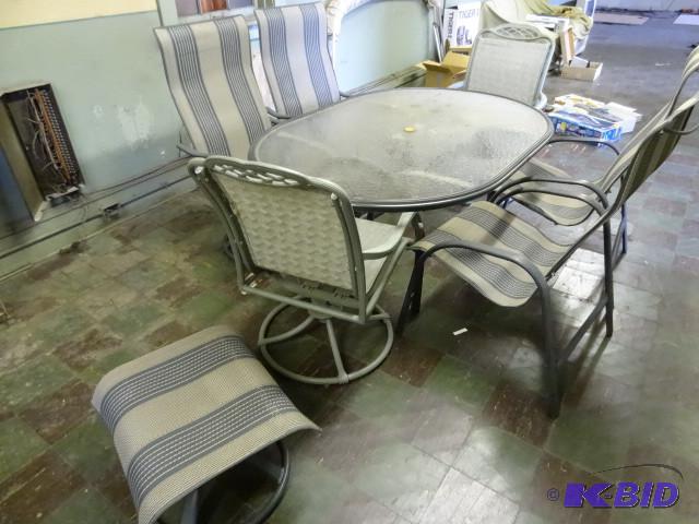 lot 136 image: Glass top patio table with 6 chairs...