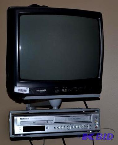 lot 10 image: TV, Wall Bracket, DVDVVHS Sylvania...
