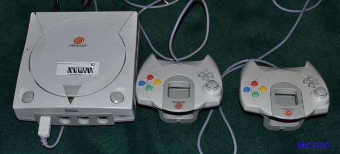 lot 52 image: Dreamcast game station with two con...