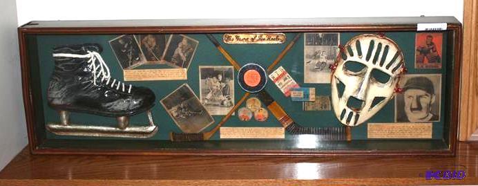 lot 55 image: Shadowbox of hockey memorabilia wit...