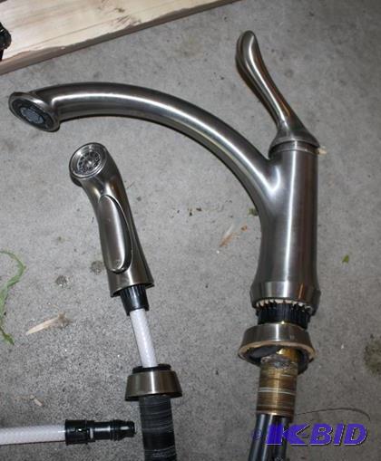 lot 88 image: Delta kitchen faucet with sprayer....