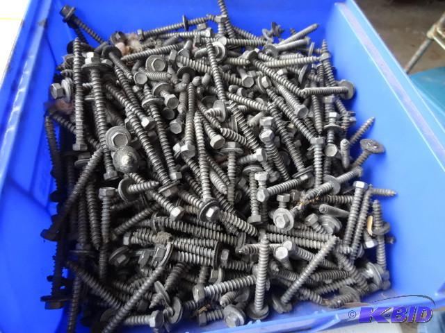 lot 119 image: Bin full of pole barn tin screws...
