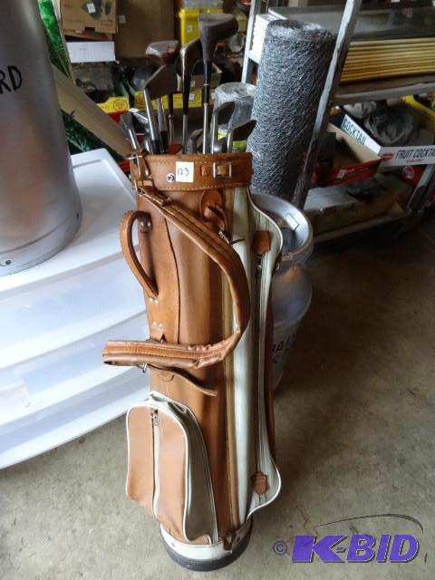 lot 123 image: Golf bag with a set of Wilson clubs...