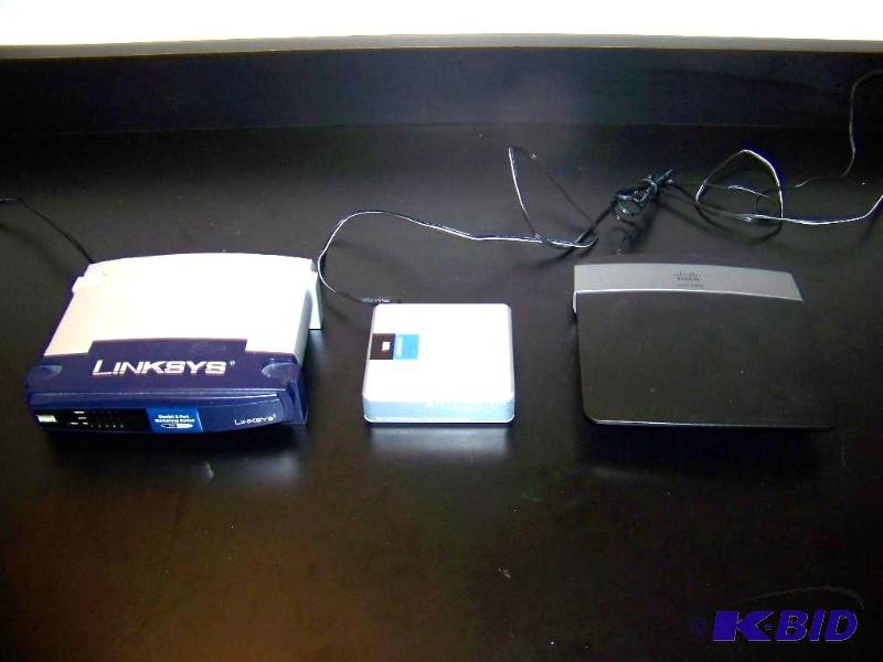 lot 18 image: (3) Wireless Routers  Workgroup Switches