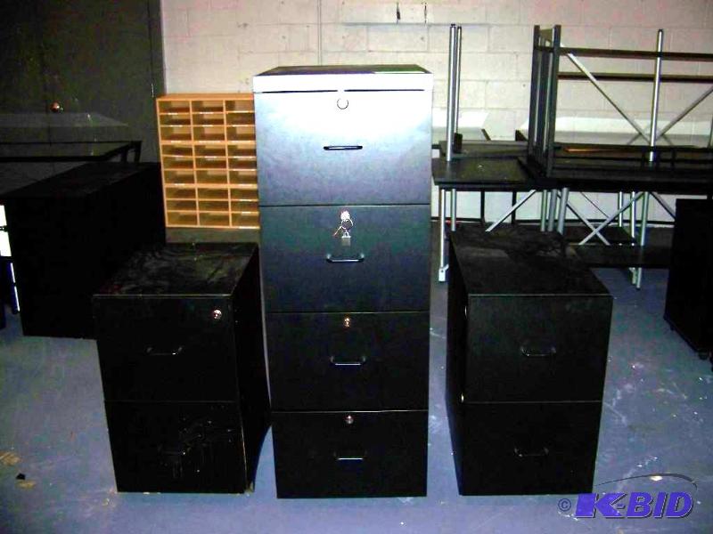 lot 62 image: (2) 2 Drawer, Black File Cabinets and (1) 4 Drawer, Black File Cabinet