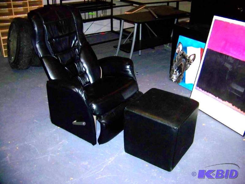 lot 69 image: Panasonic, Massage Chair  Recliner and Padded Foot Stool on wheels