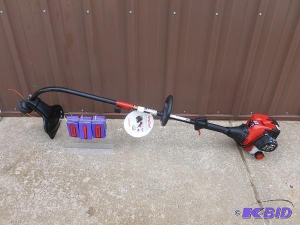 lot 10 image: Troy Built gas powered weed trimmer...