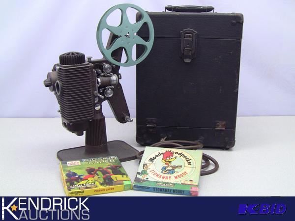 lot 40 image: Vintage Mid Century Working Revere 8mm Projector And Films