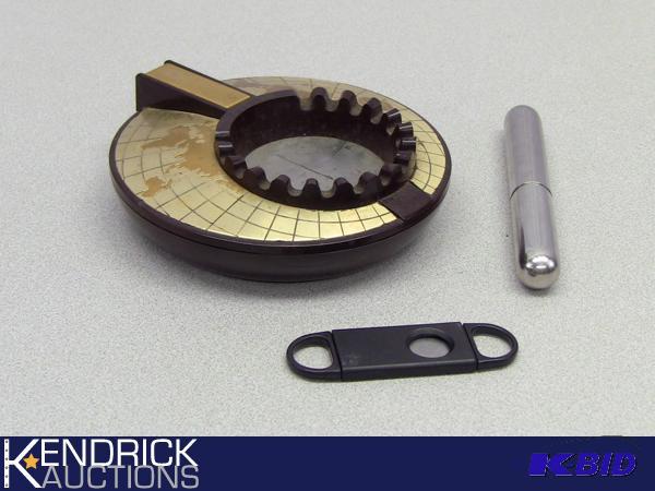 lot 5 image: Remembrance World Ash Tray, Metal Cigar Holder, and Cigar Cutter
