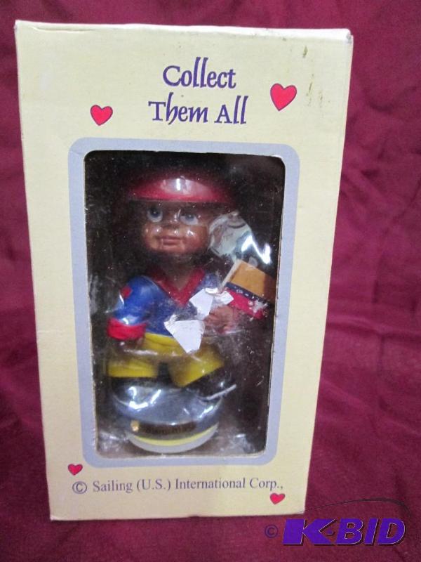 lot 190 image: National flag bobble head. Columbia...