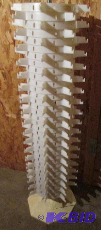 lot 409 image: White plastic sunglasses spinner, s...