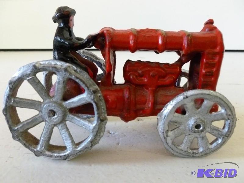 Vintage cast iron tractor that meas...