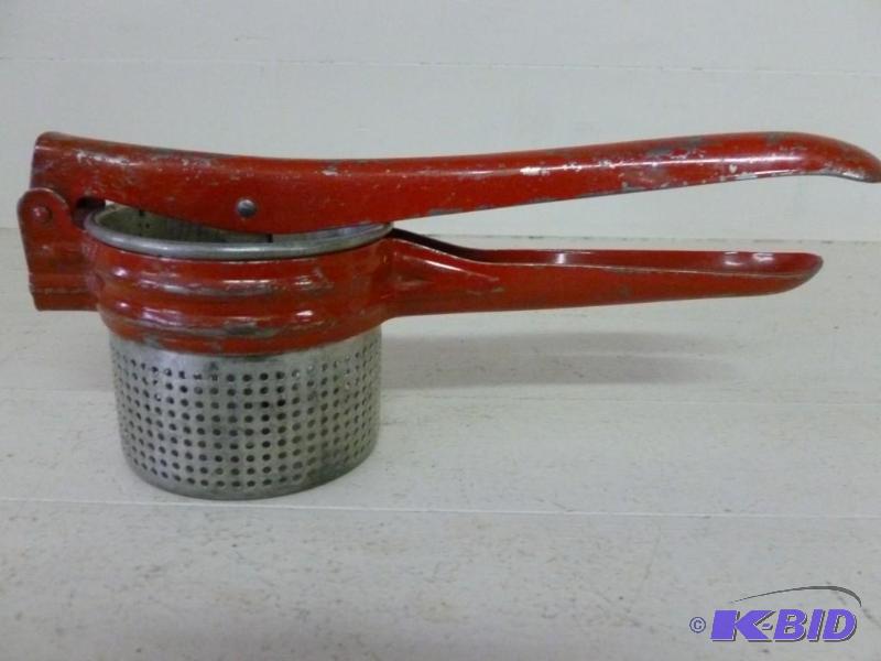 Vintage red handled potato ricer th...