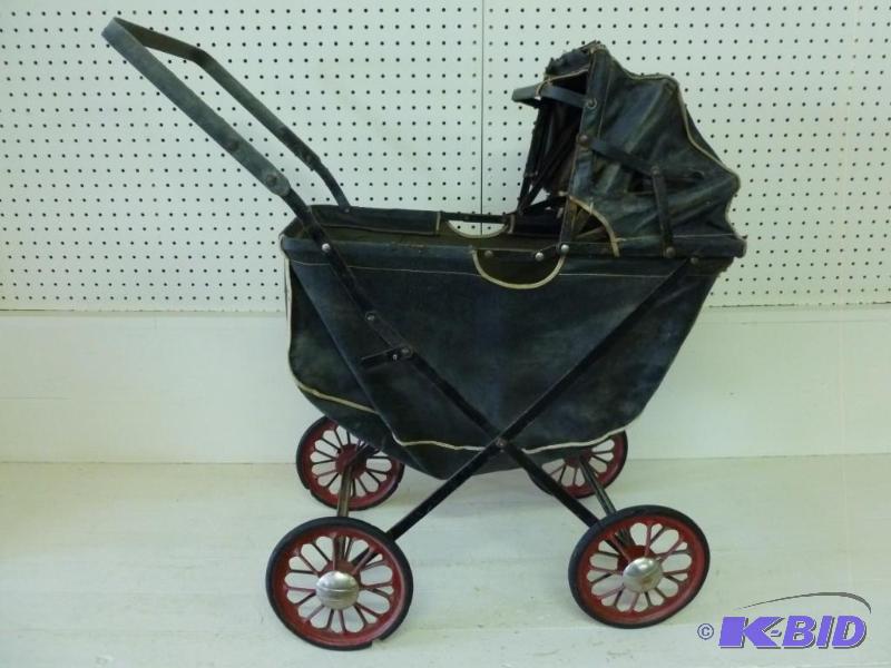 Antique baby buggy that measures 13...