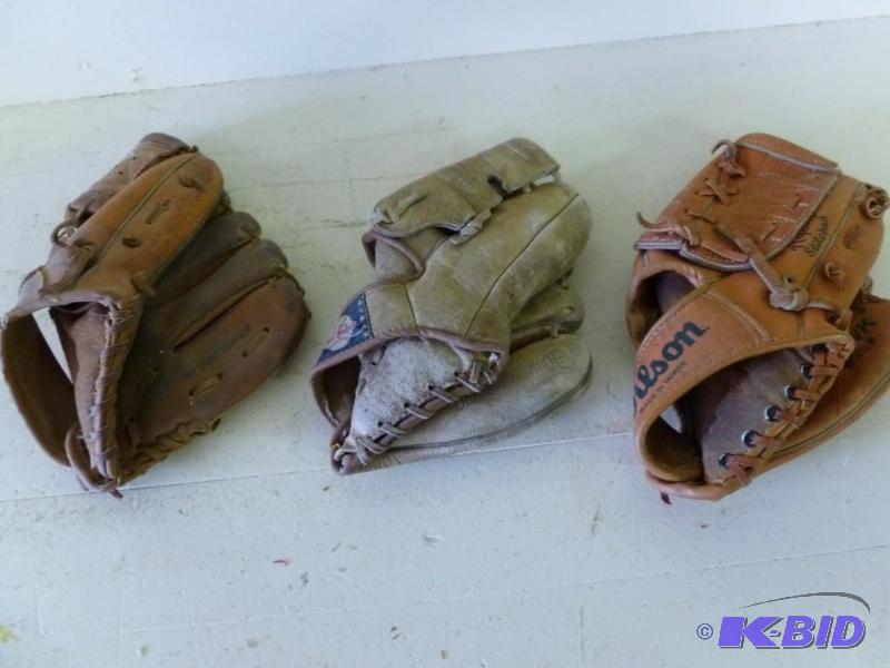 Lot of three baseball gloves that i...