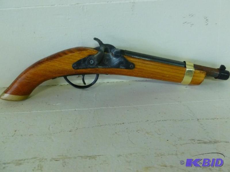 Large wood bodied cap gun that meas...