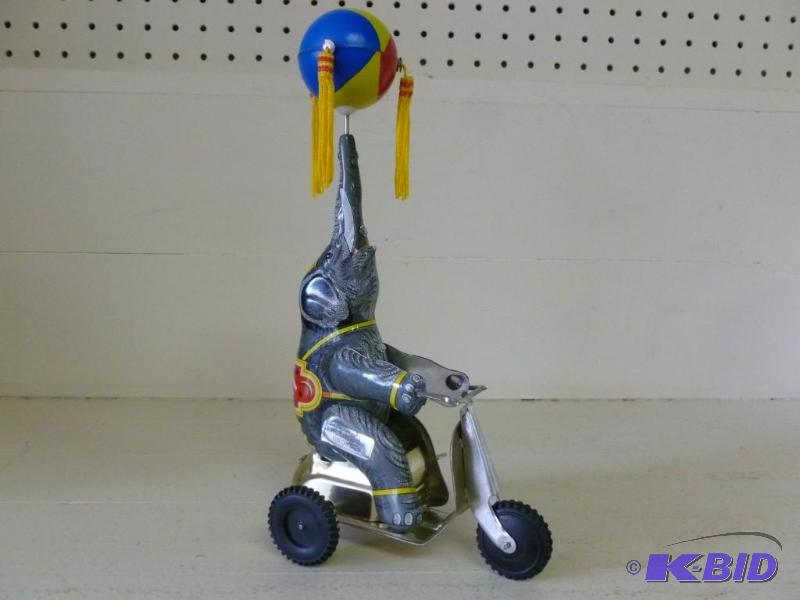 Collectible elephant on tri-cycle t...