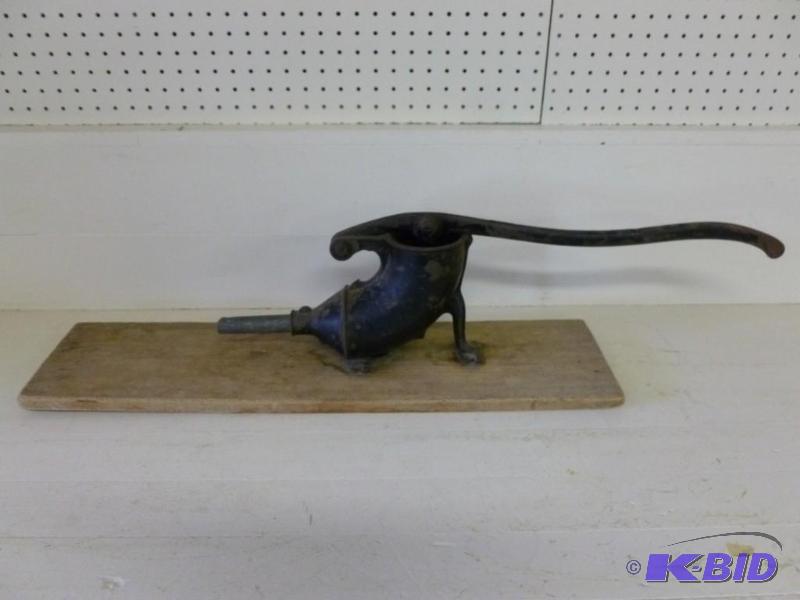 large antique cast metal sausage st...