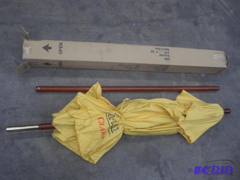 lot 89 image: 2-Piece Patio Umbrella With Beer Logo...
