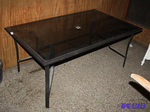 lot 146 image: Glass top patio table with metal fr...
