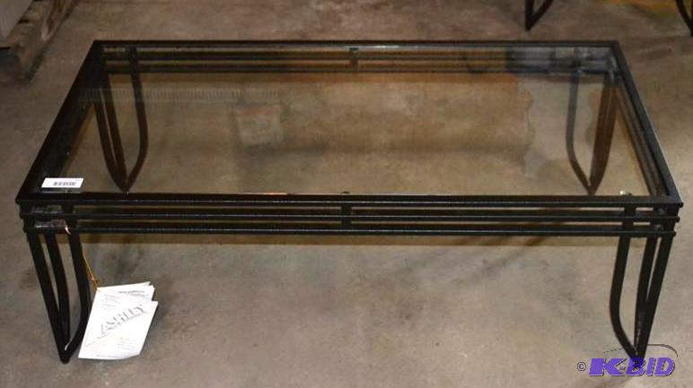 lot 51 image: Glass top coffee table with black m...