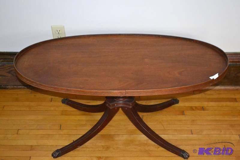 lot 64 image: Antique Wood oval coffee table with...