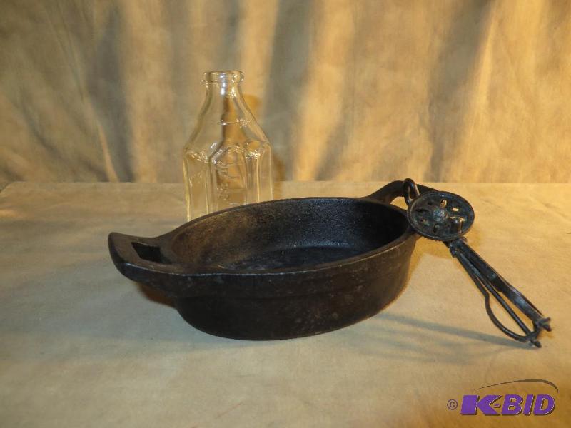 Vintage Pyrex baby bottle,  Very old mini metal egg beater and cast ware pan.
