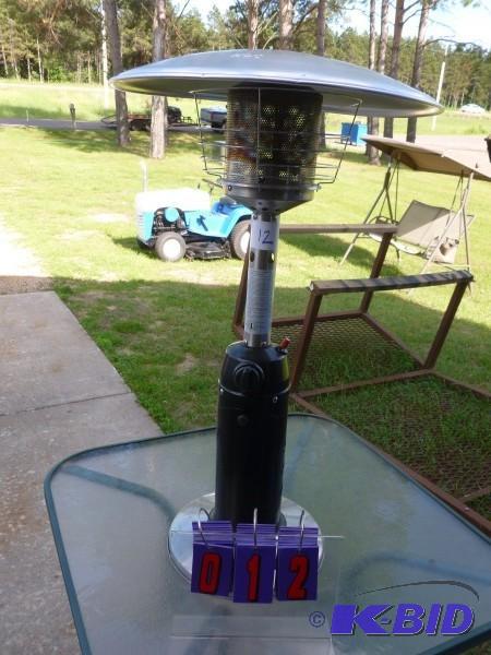 lot 12 image: 38" high patio heater. Uses sc...