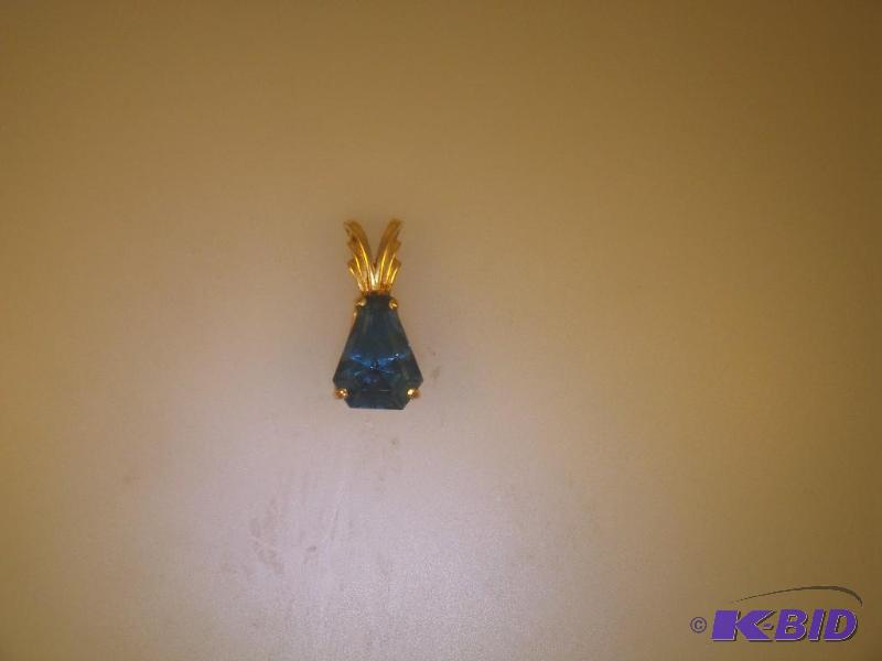 14 Karat Gold Blue Topaz Pendant