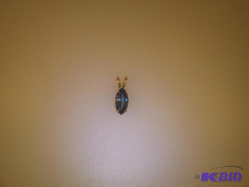 14 Karat Blue Topaz Pendant