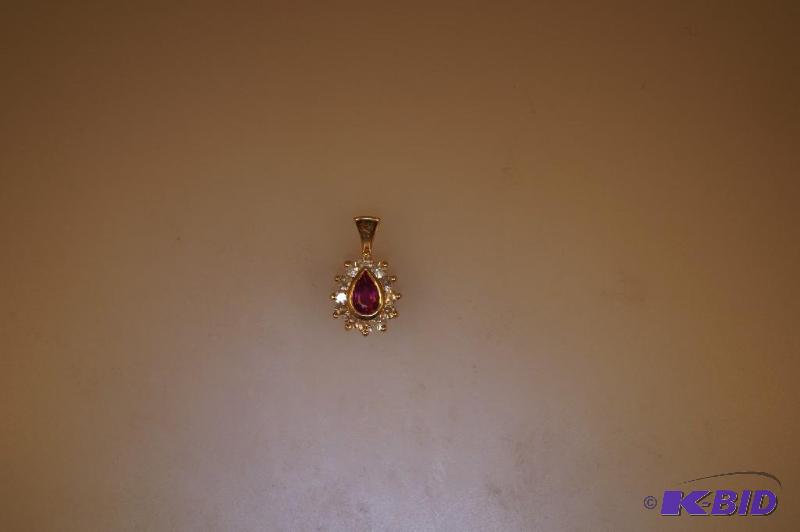 14 Karat Gold Pear Cut Ruby and 12 Diamonds