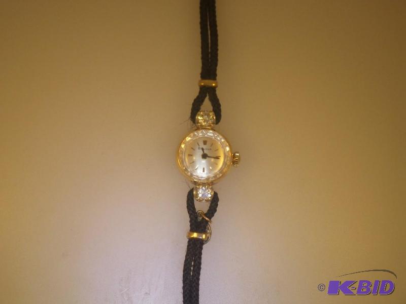 14 Karat Bulova Watch with 2 Diamonds