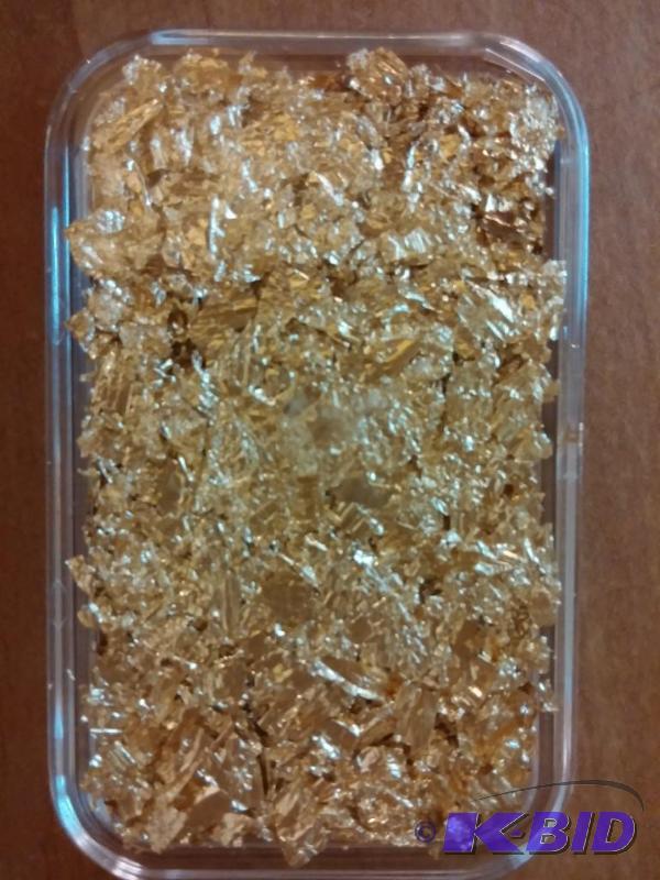 BAR OF GOLD FLAKES PACKED INTO A PL...