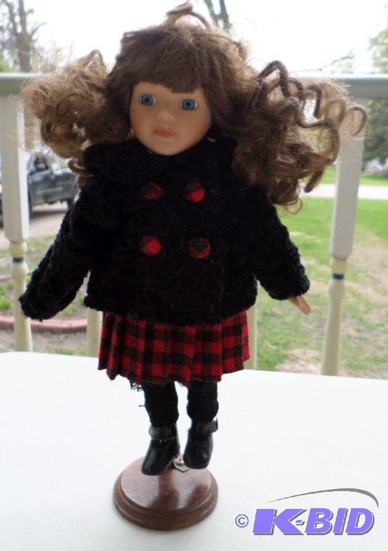Winter coated school girl china dol...