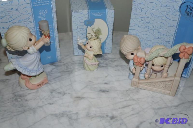 lot 104 image: Lot of 3 Christmas Precious Moments (Ornament & 2 Figurines)