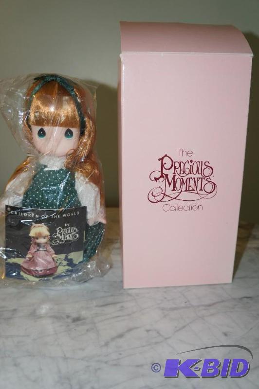 lot 22 image: Shannon  Ireland of the Children of the World Series 1994 Precious Moments Doll in UNOPENED PKG