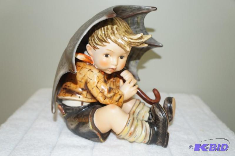 lot 220 image: Umbrella Boy 1991 M.I. Hummel Figurine