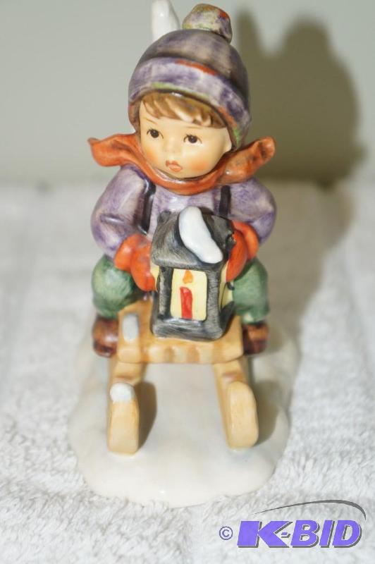 lot 229 image: Riding into Christmas 1981 M.I. Hummel Figurine