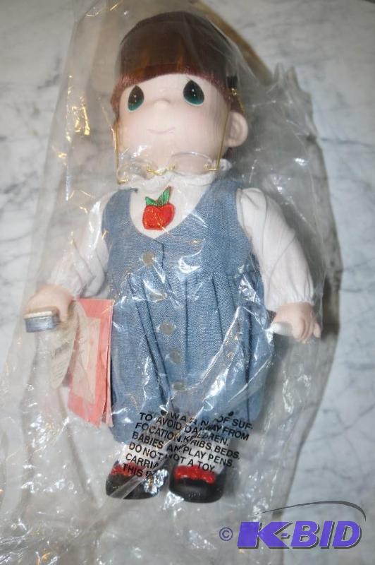 lot 36 image: Teacher from the 1997 1st Edition Career Series Precious Moments Doll